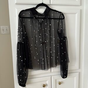 Sheer black long sleeve top with pearl detailing. 2 button closure at neck